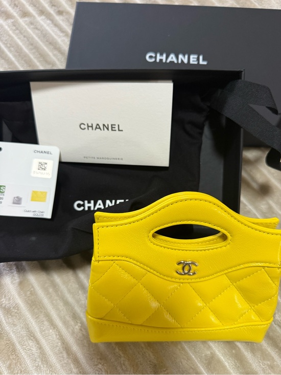 CHANEL Handbags - CHANEL Yellow Quilted Mini Top-Handle Bag